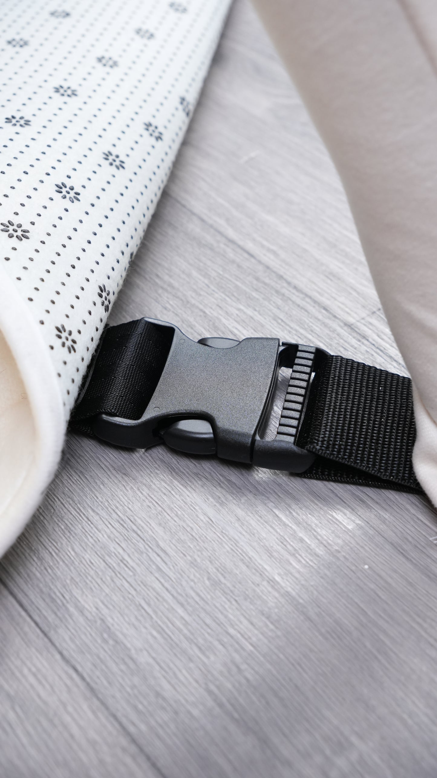 Close-up of the buckle and strap on an abdl playgym designed for comfort and safety.